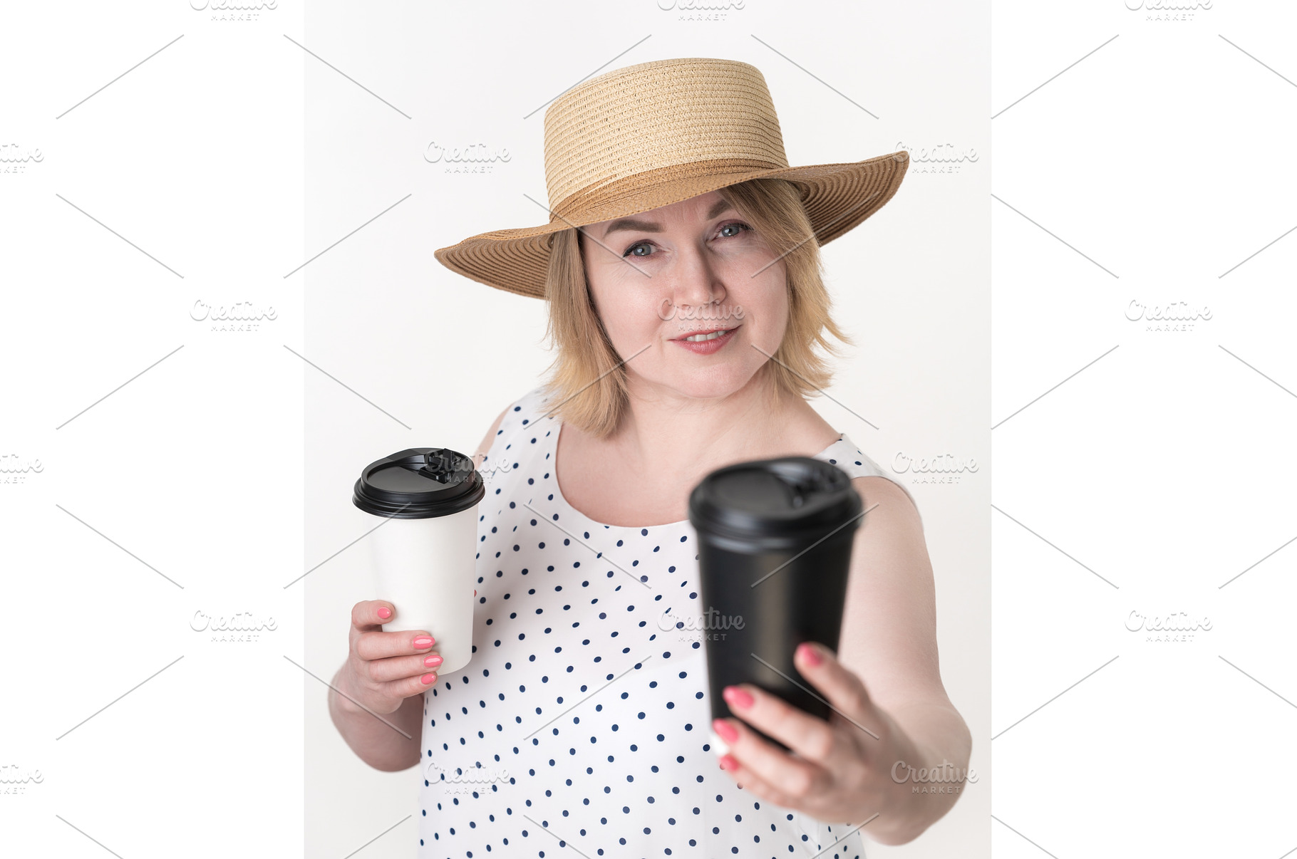 Blonde woman holding black and white, a Person Photo by Alexander-Piragis