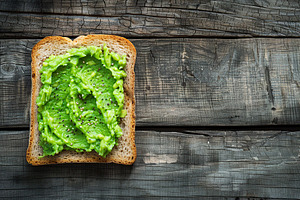 Toast bread with avocado puree on wooden table. Vegetarian food., a Food & Drink Photo by AlyaAnd