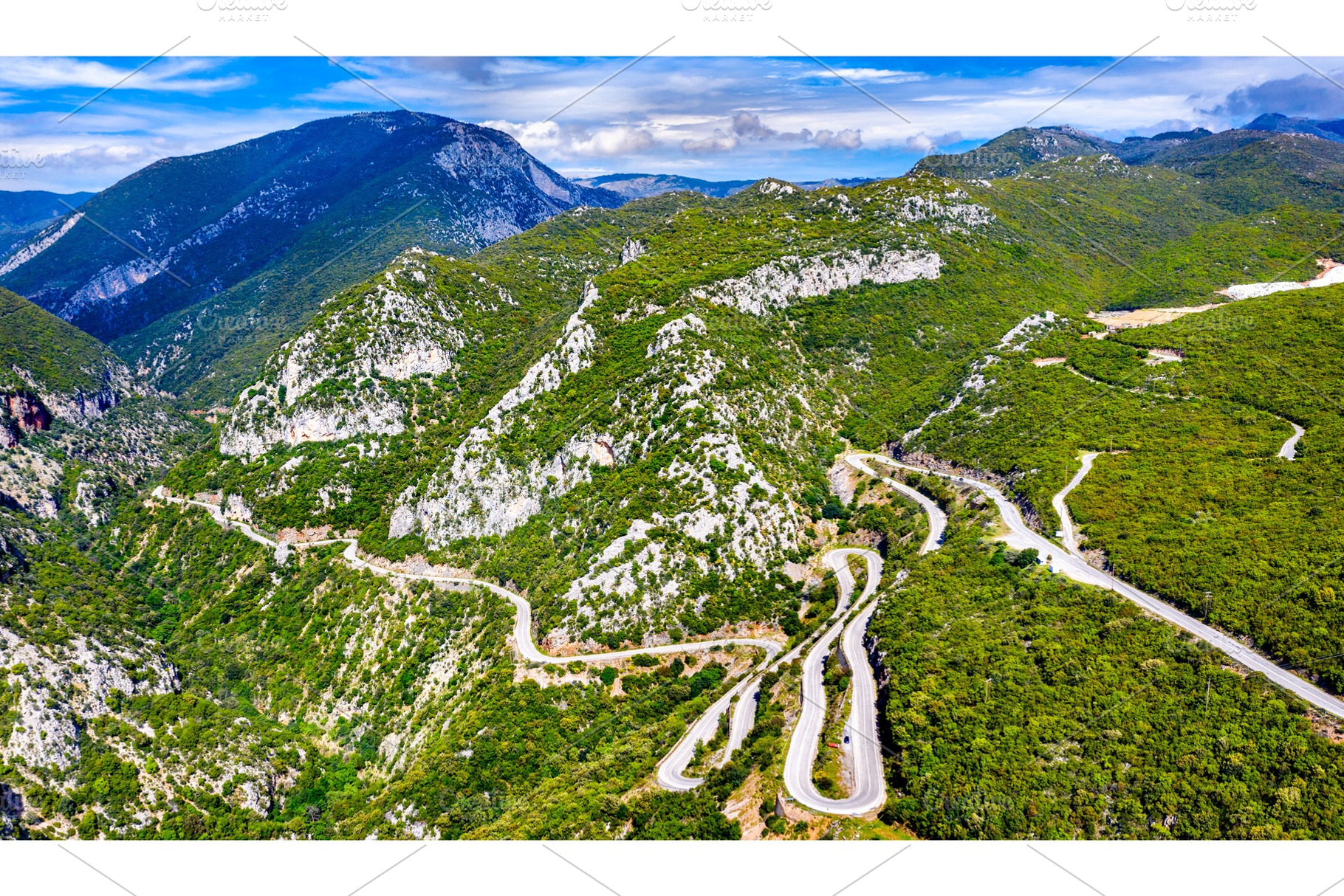 Winding road in the mountains of containing mountain, road, and landscape, a Transportation Photo by Leonid Andronov
