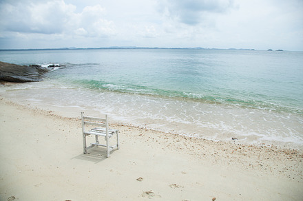 White wooden chair featuring bay, beach, and calm, an Abstract Photo by a454