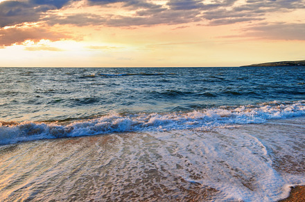 Sea surf wave break on sunset sandy coastline, a Nature Photo by YuriyB