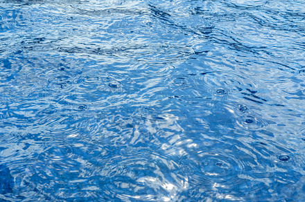 Blue water surface texture during ra, a Background Photo by Kate Molchanova