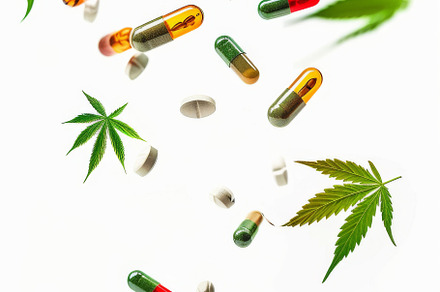 Colorful pills and cannabis leaves scattered on white background, a Photo by Dvoevnore photos