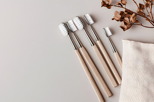 Eco toothbrushes with wooden handles, a Beauty & Fashion Photo by Photostock