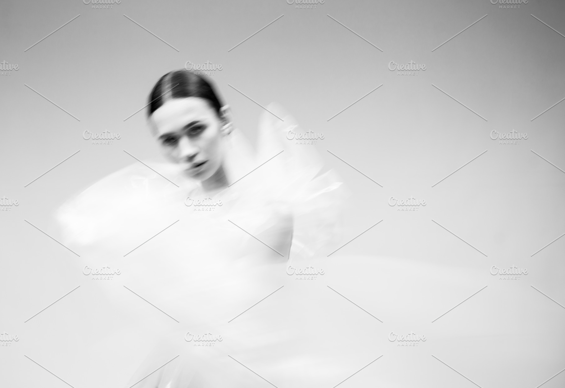 Black and white blurred portrait of containing vogue, fashion, and plastic, a Beauty & Fashion Photo by sport&beauty stock photo