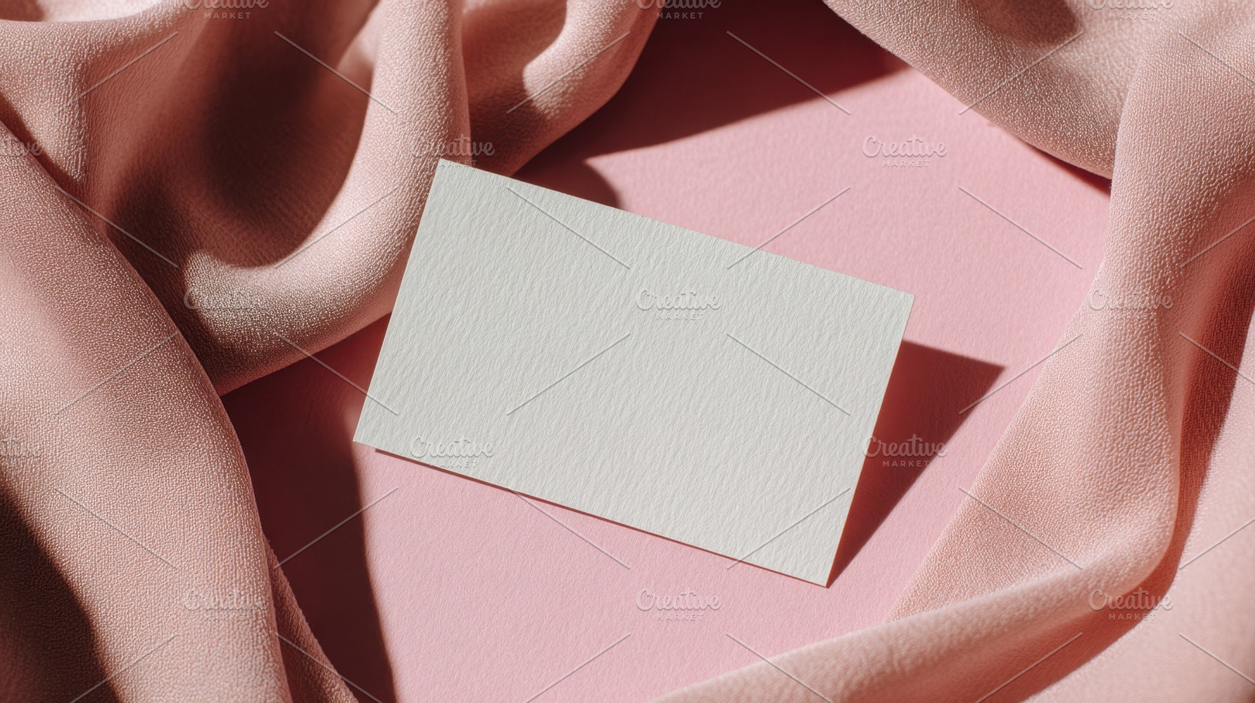 Blank card on pink fabric surface, a Photo by Beautiful things