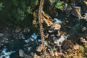 Wooden bridge aerial view river and
