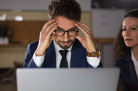 Front view of tired man in eyeglasse