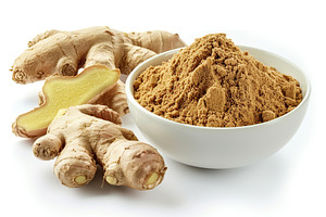 Ground dry ginger in bowl isolated on white background, a Food & Drink Photo by AlyaAnd