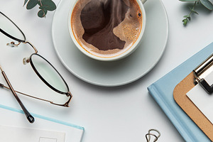 Eucalyptus, coffee cup, keyboard and stationery creating relaxin, a Business Photo by Olena Rudo