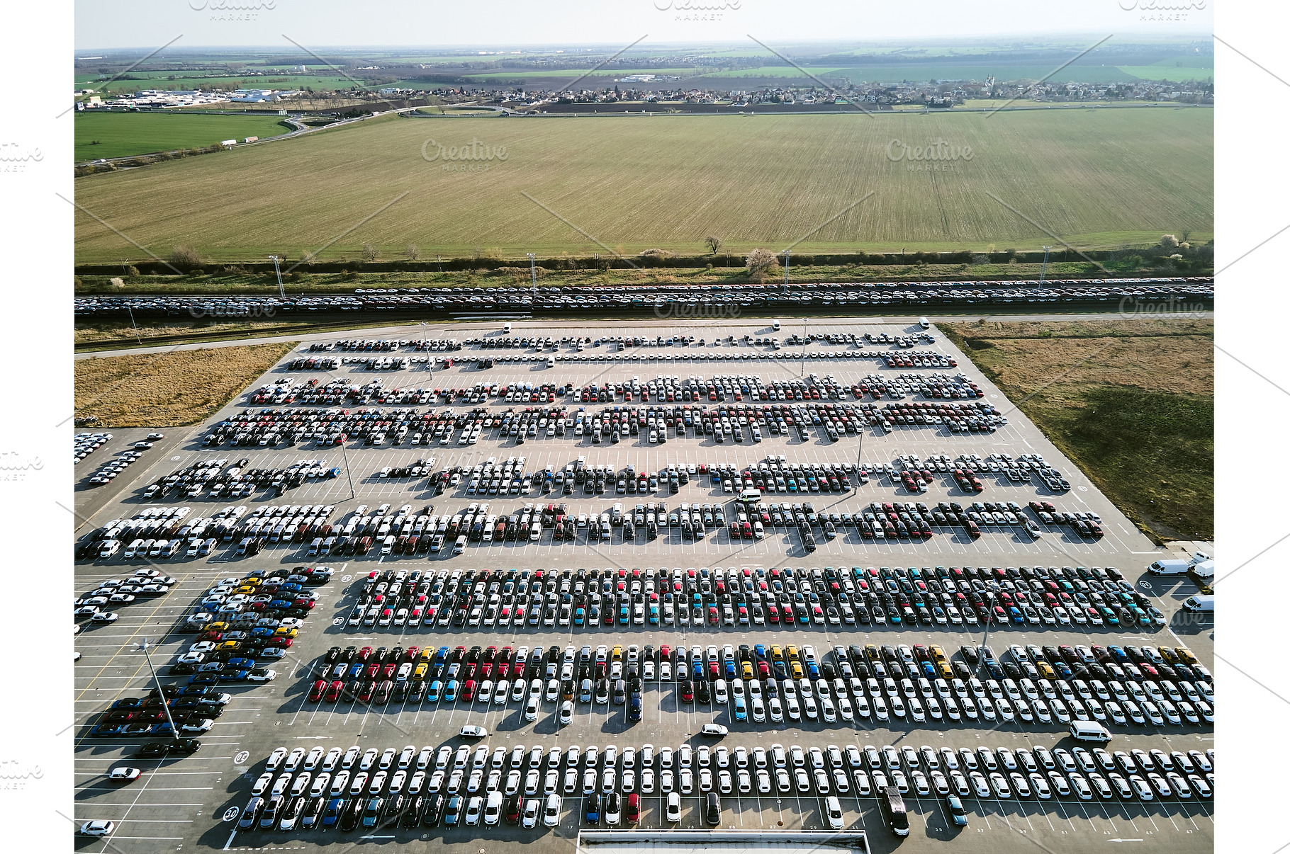 Aerial view of a massive parking lot, an Industrial Photo by HalfPoint