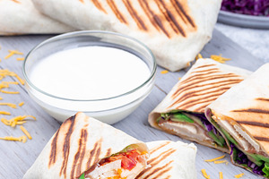 Chicken wraps with red cabbage, avocado, tomato, lettuce, cheddar cheese, on wo, a Food & Drink Photo by iuliia_n