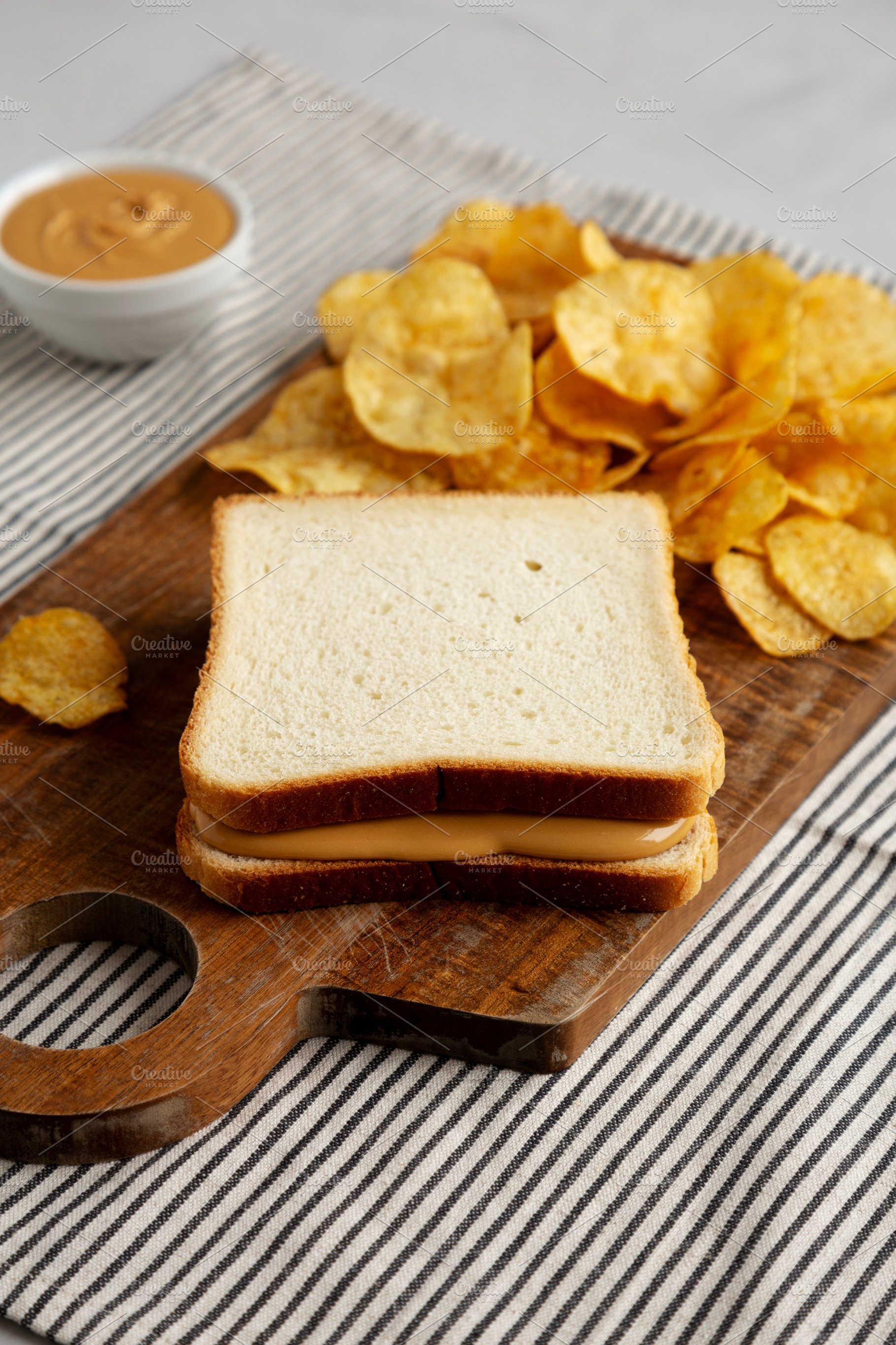 Homemade American Peanut Butter Sandwich on a Wooden Board, side, a Food & Drink Photo by LiudmylaChuhunova