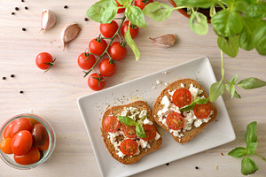 Overhead Tomato Feta Toasts with Basil, a Food & Drink Photo by Davizro's Market