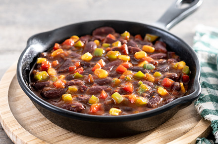 Mexican chilli beans with vegetables in iron pan