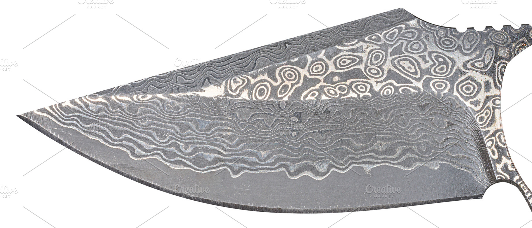 A knife blade with the characteristic wavy and ringed pattern ty, an Industrial Photo by ndanko