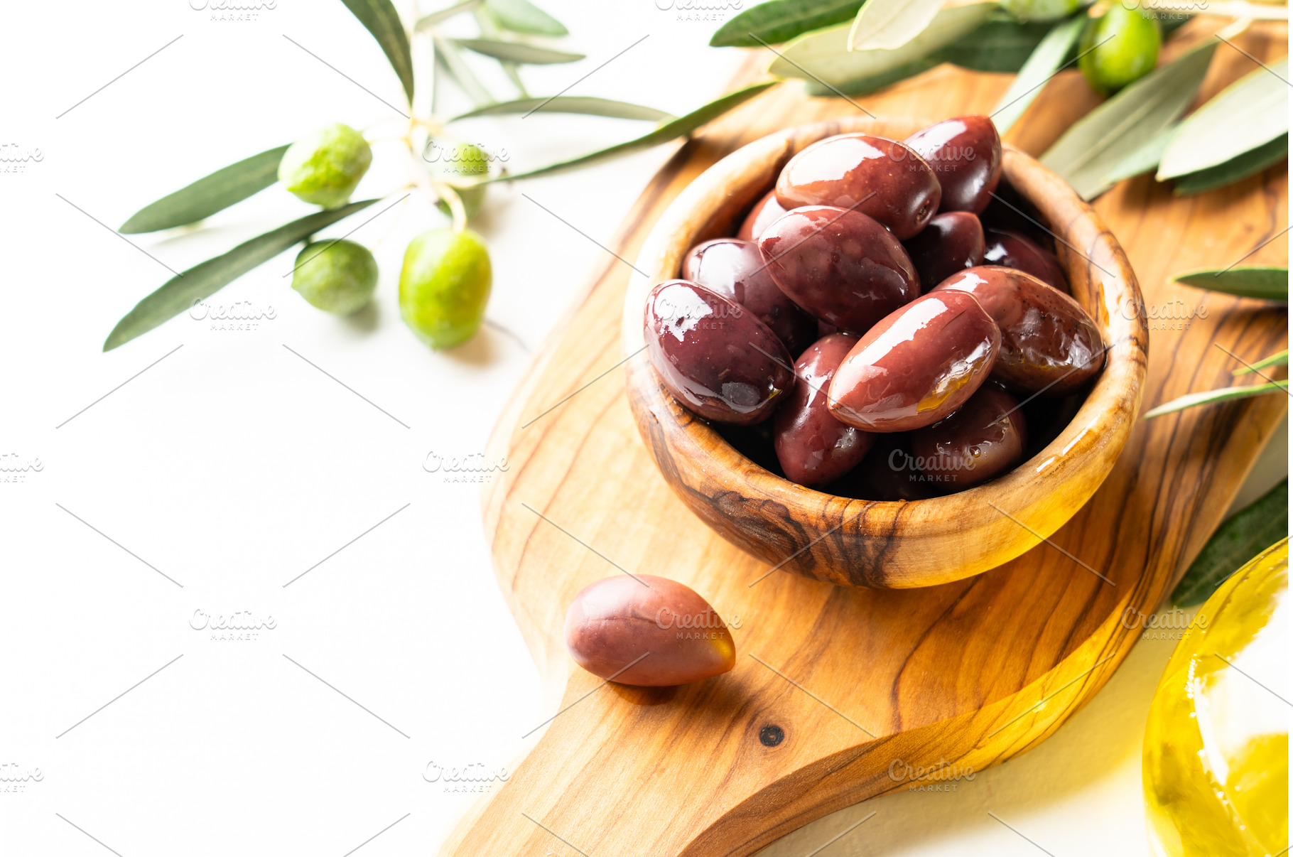 Olives in the bowl at white table., a Food & Drink Photo by Nadia-nb
