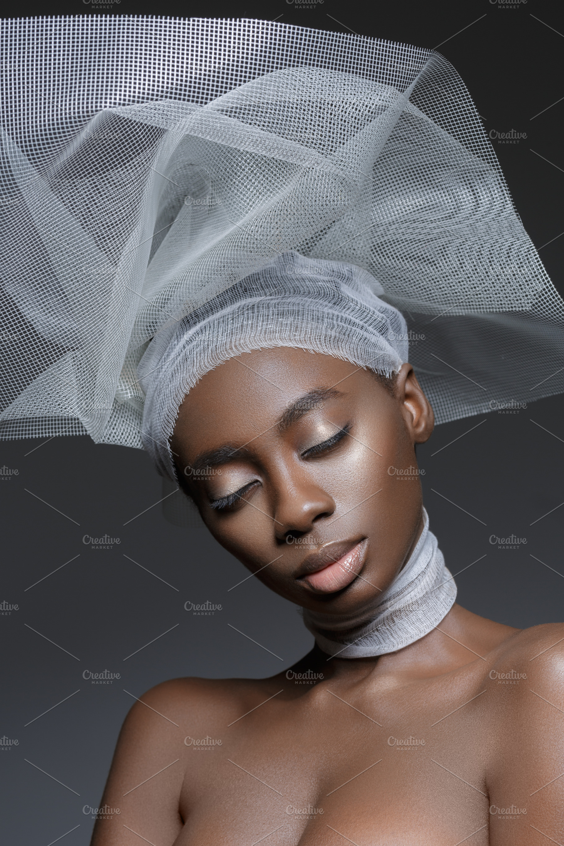 Beautiful african girl with veil hat stock photo containing studio and makeup, a Beauty & Fashion Photo by Sweet Studio