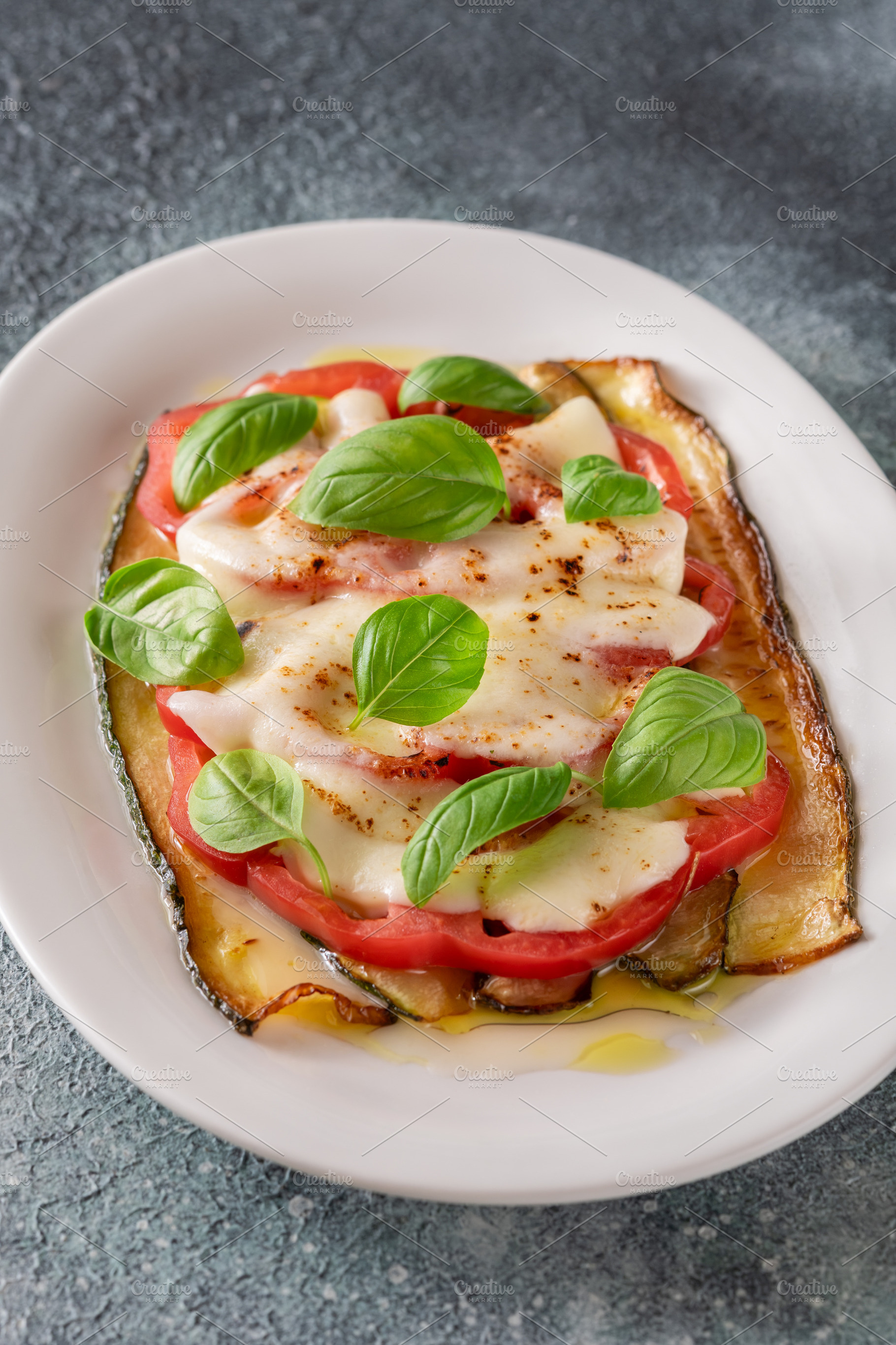 Grilled Zucchini With Tomato Torched Mozzarella Basil On Elegant, a Food & Drink Photo by Alexander Prokopenko