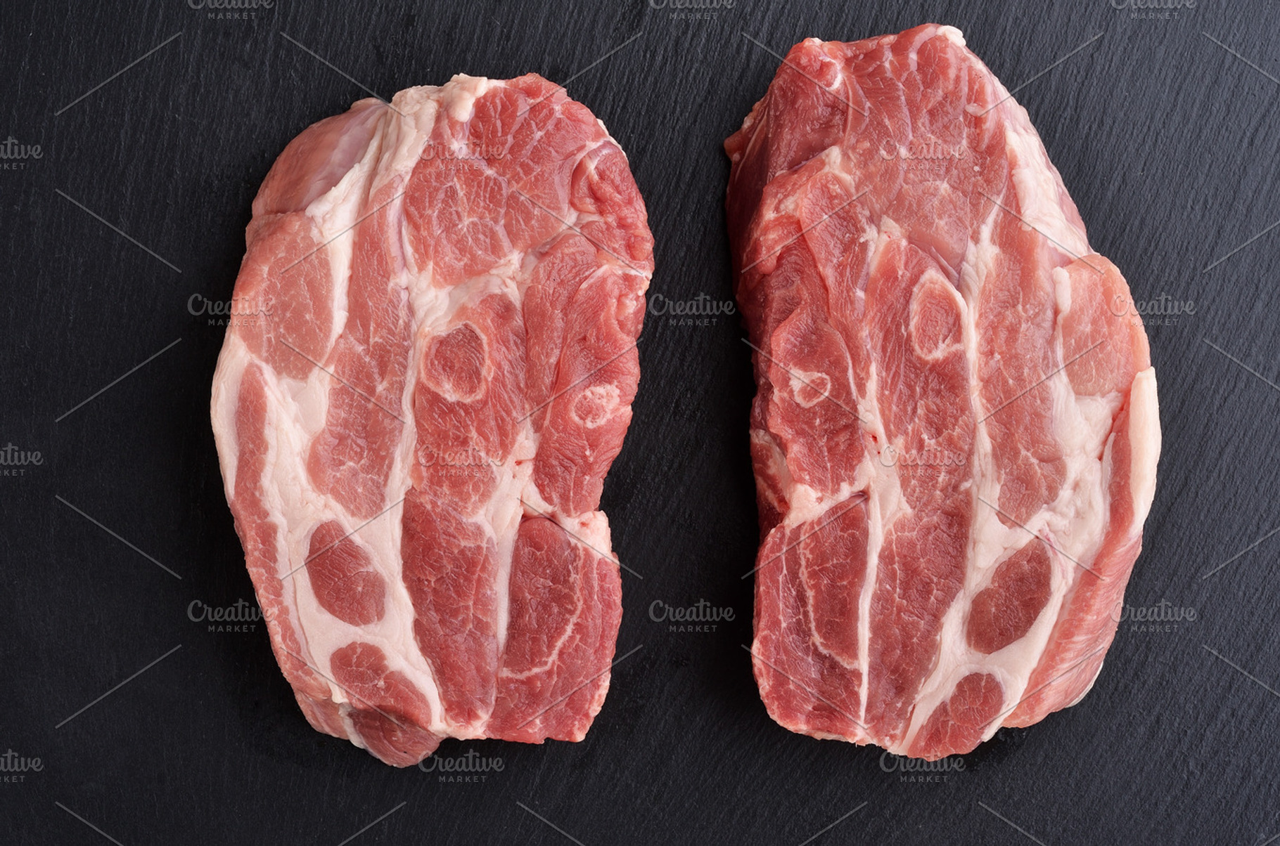Fresh raw pork shoulder butt slices containing pork, meat, and shoulder, a Food & Drink Photo by Food Stock
