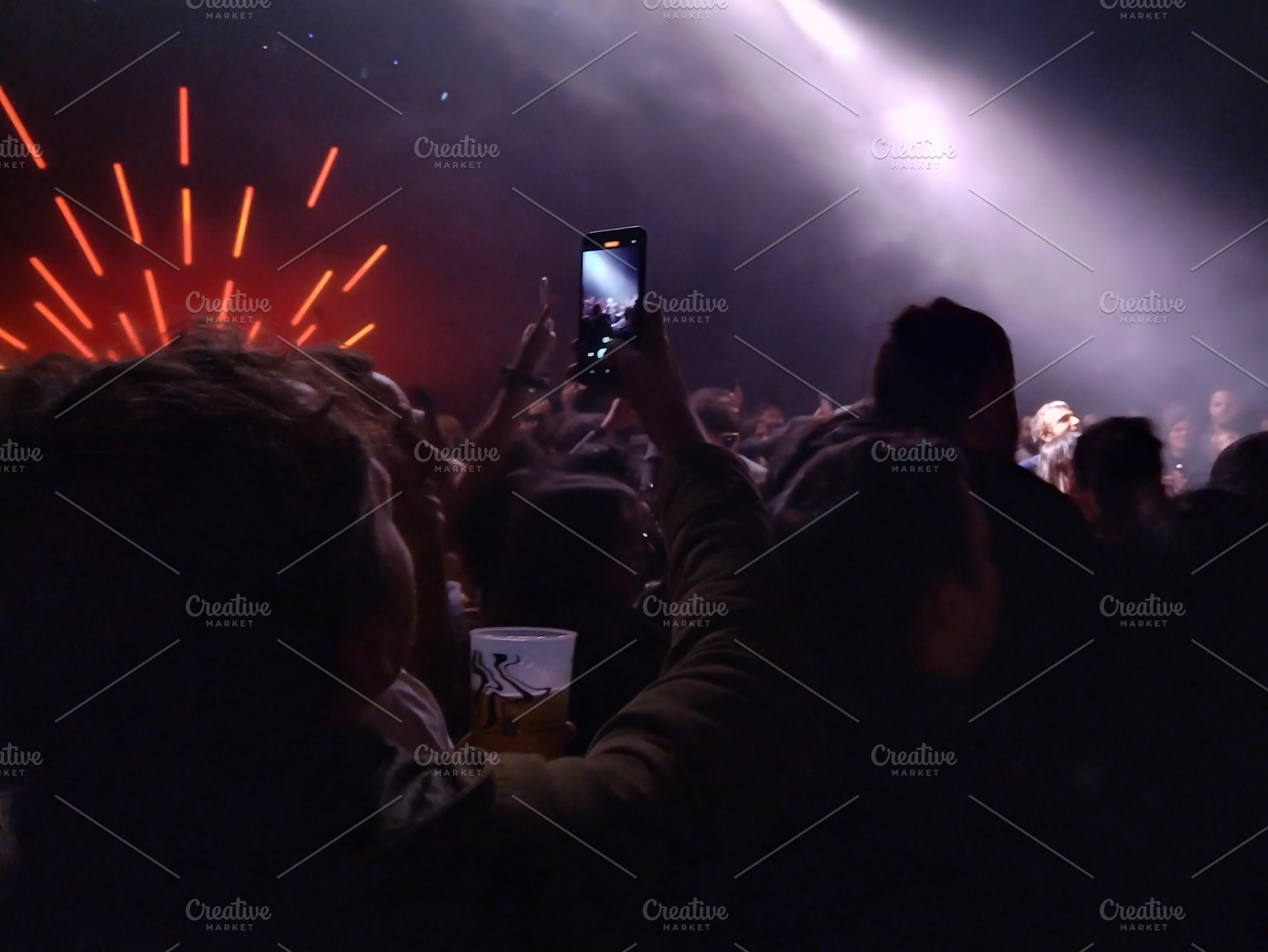 Live band on stage with radial light beams, a Sports & Recreation Photo by DanFLCreativo