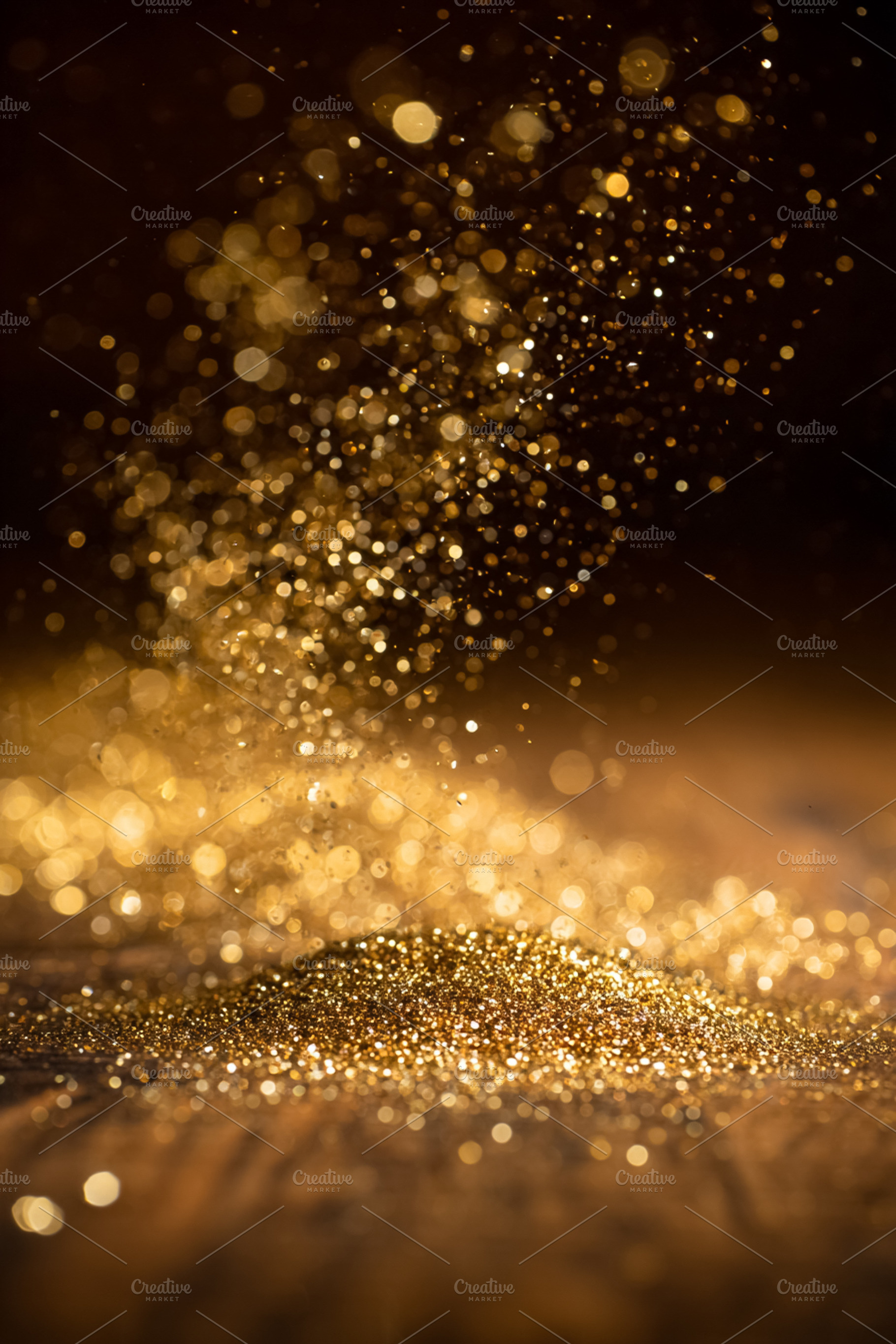 Golden glitter falling onto a shimmering surface, creating a festive sparkling, a Photo by Studio ANNA