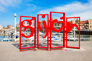 Gijon symbol red monument in the centre of Gijon city in Asturia, a Photo by saiko3p