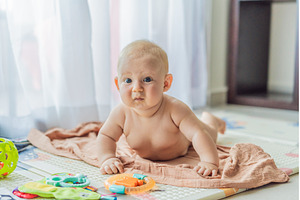 Little baby playing with toys on a, a School & Education Photo by Elizaveta Galitskaya
