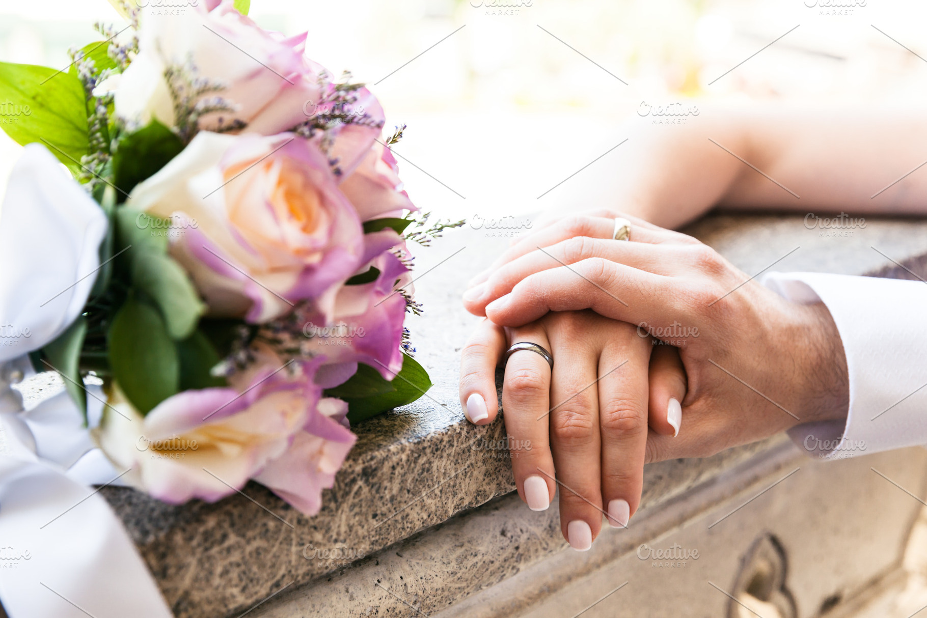 Young married couple holding hands stock photo containing rings and wedding, a Person Photo by PhotographerJen