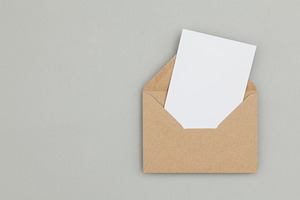 Blank white card with brown envelope, a Background Photo by ink drop