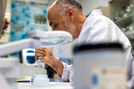 Scientist working with pipette in la, a Health & Medical Photo by Perpis