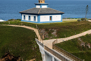 Lighthouse on an islet with a bridge, a Holiday Photo by Perpis
