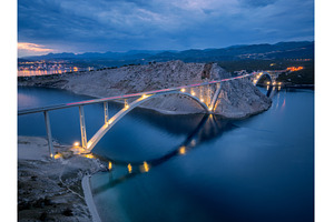 Bridge over the sea at sunset, an Architecture Photo by den-belitsky