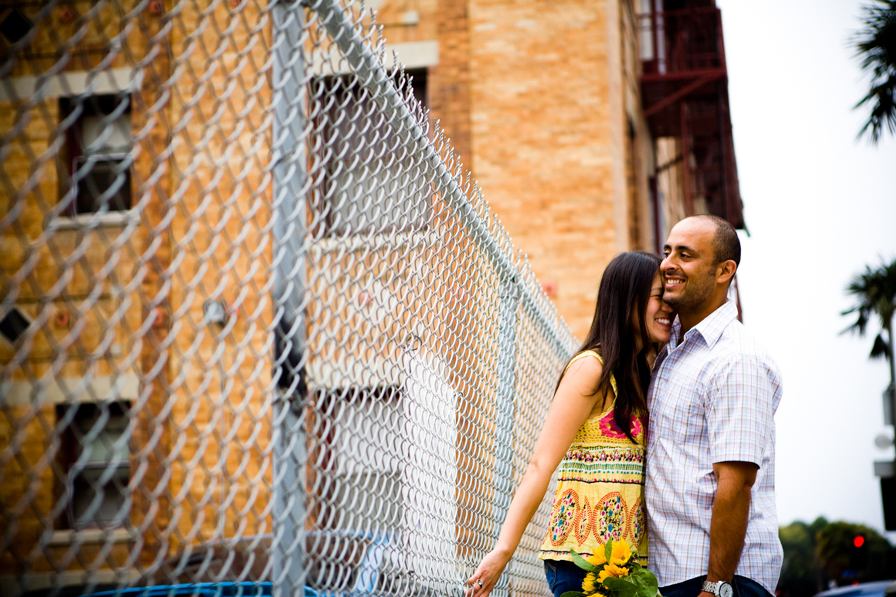 Engagment Couple By Urban Fence