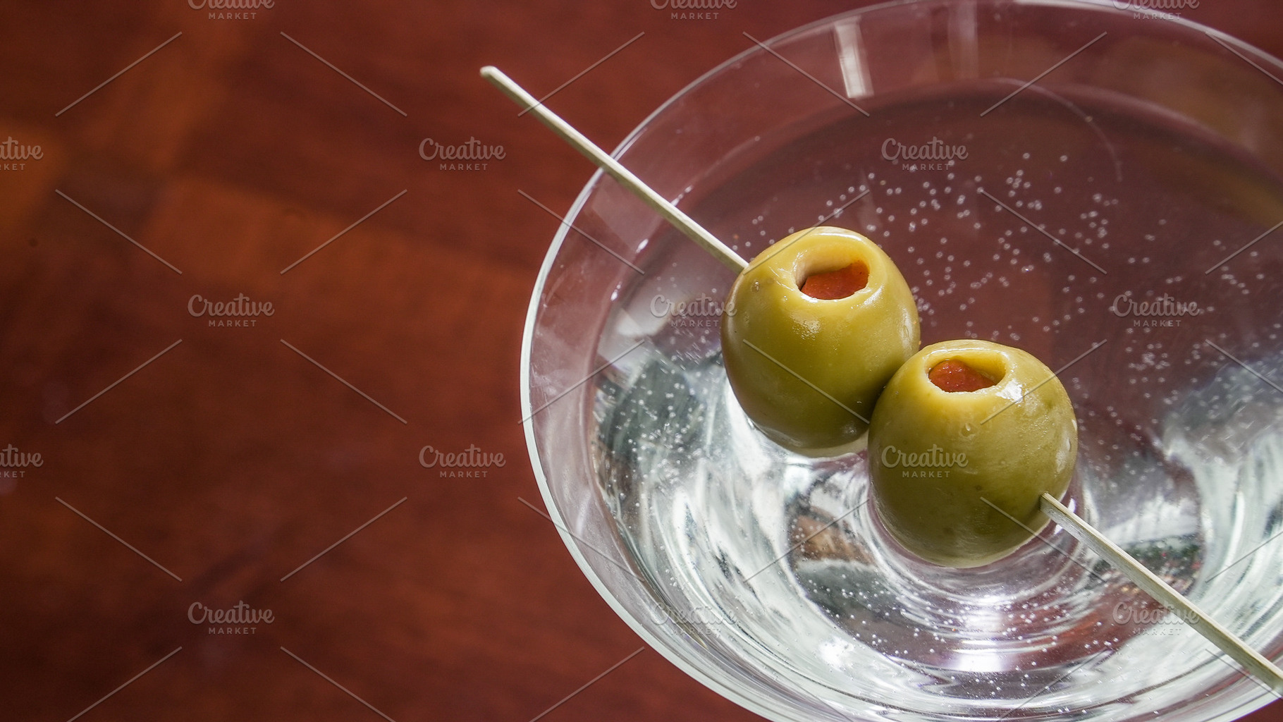 Drink with green olives on a skewer, a Food & Drink Photo by 1miromiro