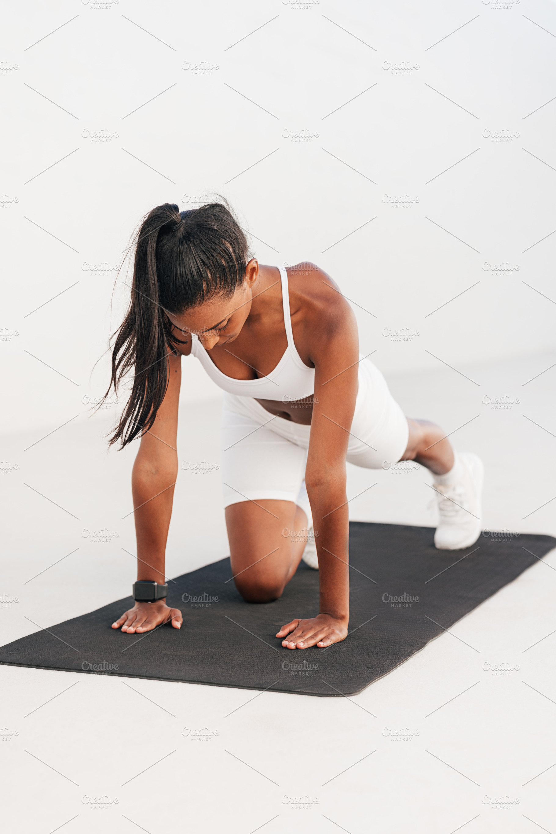 Slim female exercising on a mat, a Sports & Recreation Photo by Artem Varnitsin