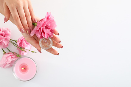 Concept of hand care with cosmetics on white background, a Beauty & Fashion Photo by AtlasStudio PRO