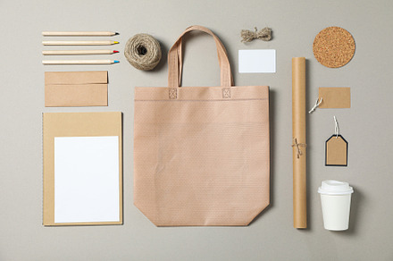 Mockup. Corporate stationery, tote bag and paper cup on grey bac, a Business Photo by AtlasStudio PRO