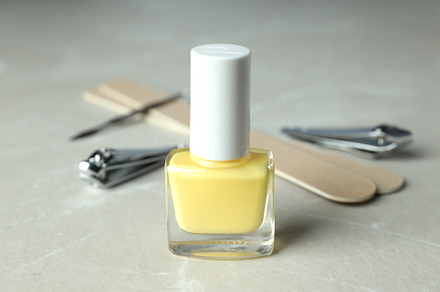 Concept of nail care with manicure accessories on light textured, a Beauty & Fashion Photo by AtlasStudio PRO