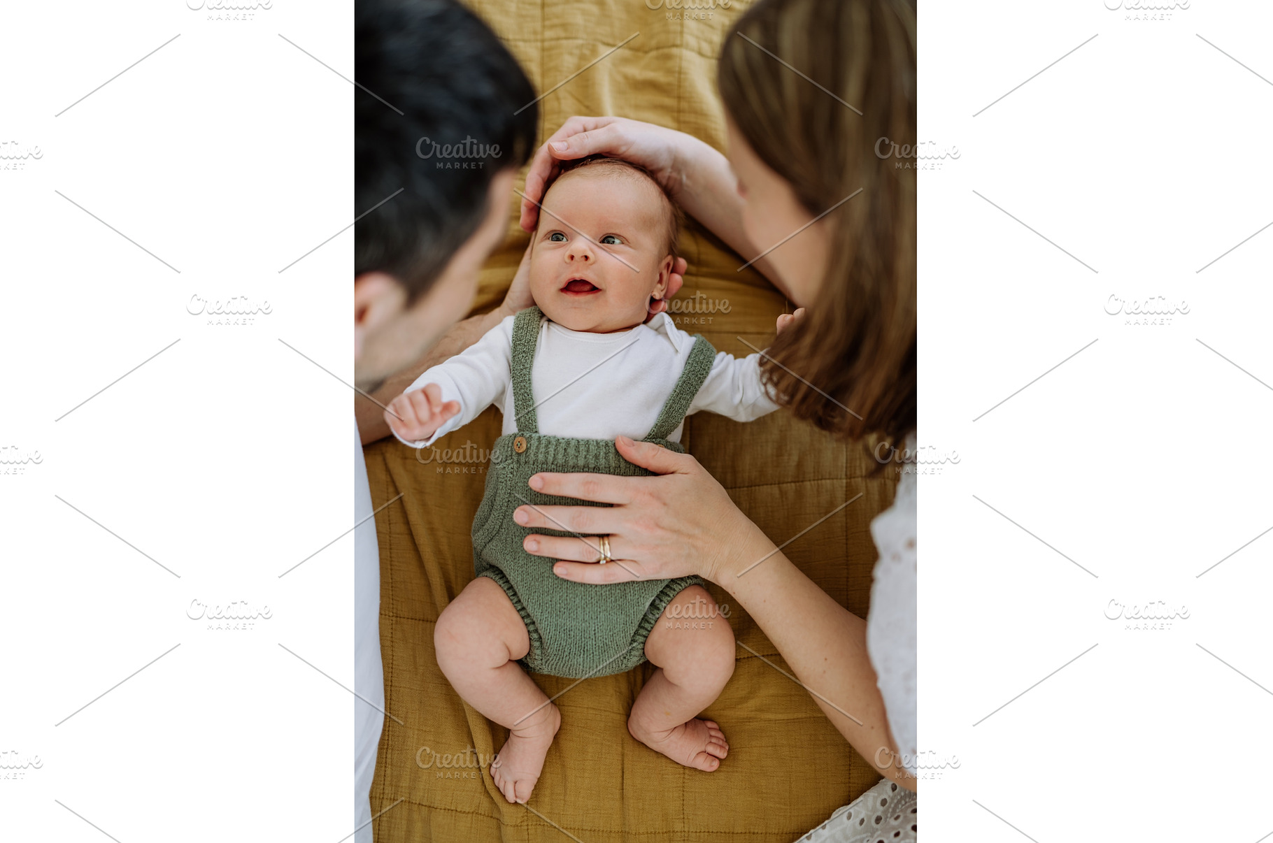 Happy parents cuddling with their, a Person Photo by HalfPoint