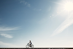 Girl enjoying bike ride silhouette