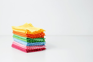 Colorful cleaning cloths neatly arranged, bringing brightness and energy to spr, a Photo by matucha