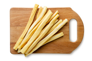 Suluguni cheese sticks on a wooden, a Food & Drink Photo by innakreativ