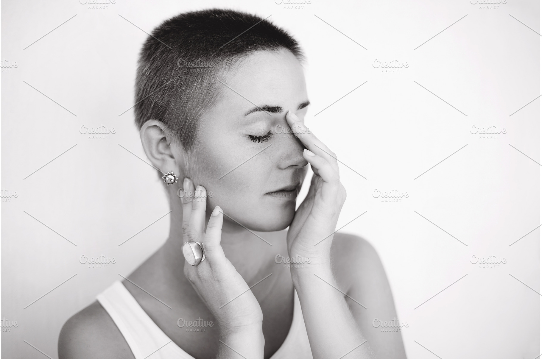 Woman with shaved head closing eyes, a Beauty & Fashion Photo by Anna Efetova