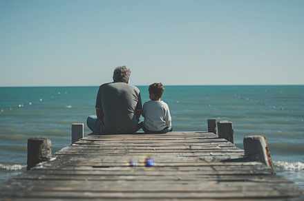 A father and son sitting on a wooden, a Photo by Iftikhar Alam