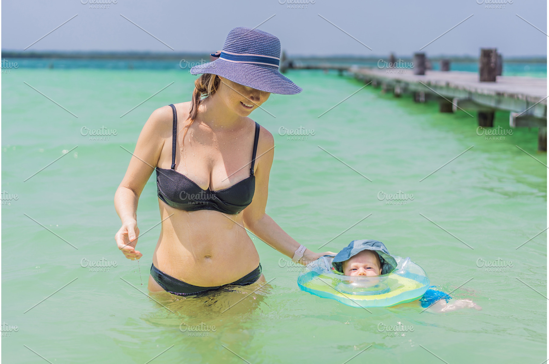 Baby floating in a neck ring in, a Person Photo by Elizaveta Galitskaya