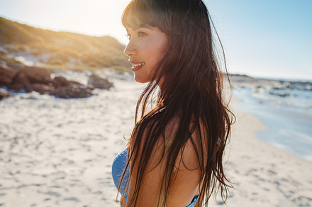 Young woman on the beach stock photo containing away and beach, a Person Photo by Jacob Lund