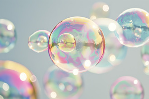 Rainbow soap bubbles on grey background, a Photo by AlyaAnd