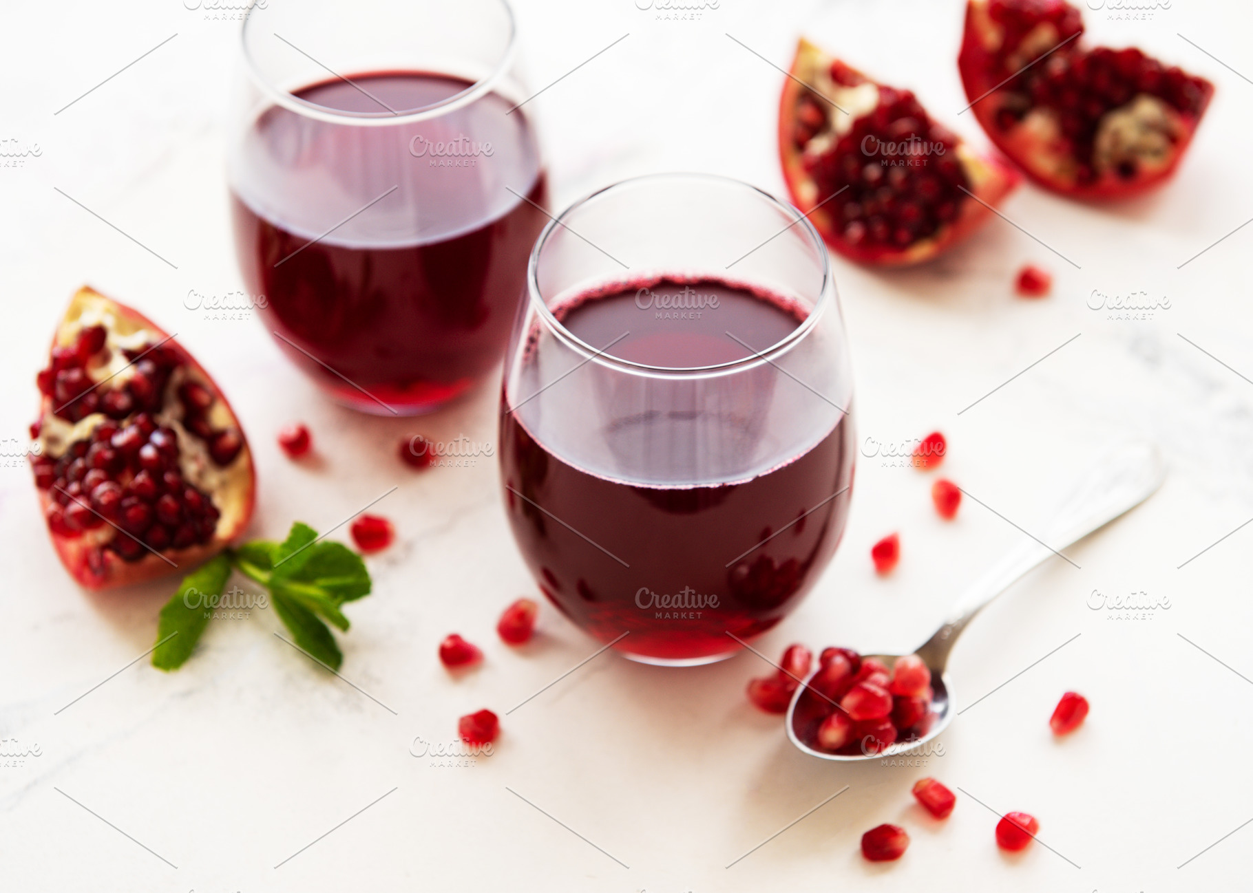 Pomegranate juice with fresh pomegra containing pomegranate, juice, and, a Food & Drink Photo by Olena Rudo