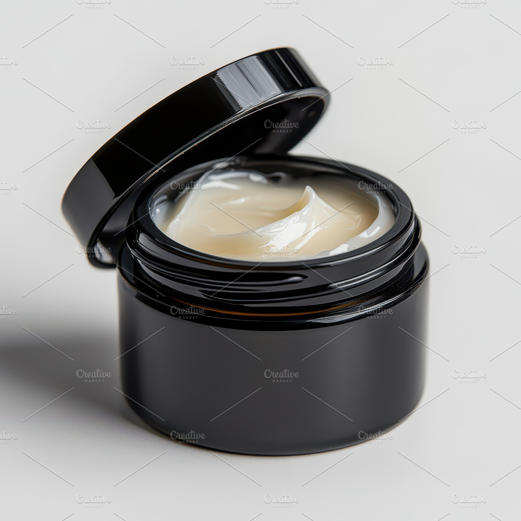 A jar of cream with lid open, cosmet, a Beauty & Fashion Photo by Pixeness Studio
